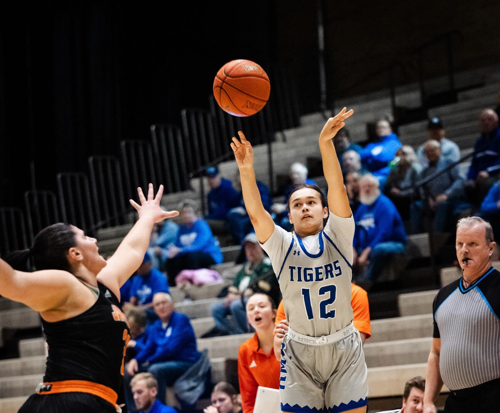 TIGERS MAKE IT 16 STRAIGHT AGAINST LANCERS BEHIND HAYES CAREER-HIGH 18 IN 76-50 WIN